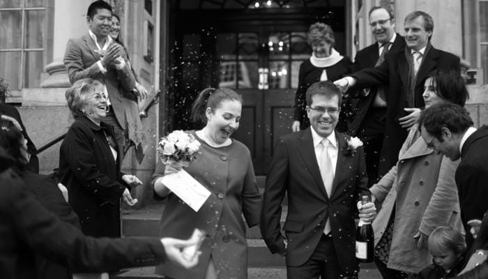 chelsea register office steps with confetti Wedding Photographer at Chelsea Register Office and The Dorchester Hotel, London for Anat and Jose