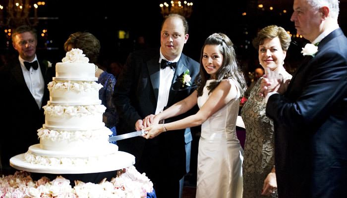 bride and groom cutting cake at the dorchester Charlie and Grants Wedding Photographed at The Dorchester in London