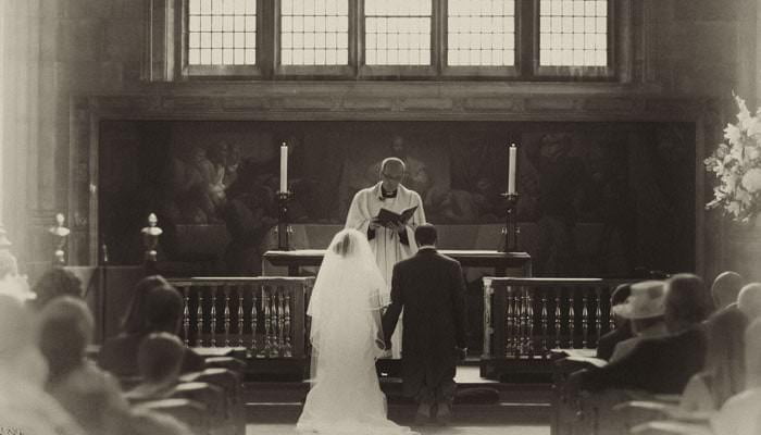 Wedding photograph of Emma and Steven in church service Wedding Photographer for Emma and Steven, at All Hallows by the Tower, Boat Trip & Fulham Palace, London