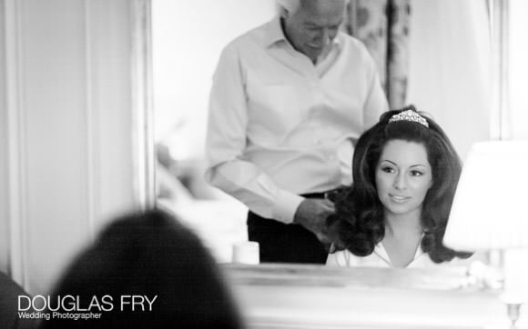 Bride having hair prepared at Dorchester Hotel ready for wedding