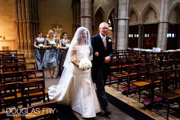 Wedding Photographer at St Columbas Catholic Church in Spanish Place, London - Father and bride walking down aisle