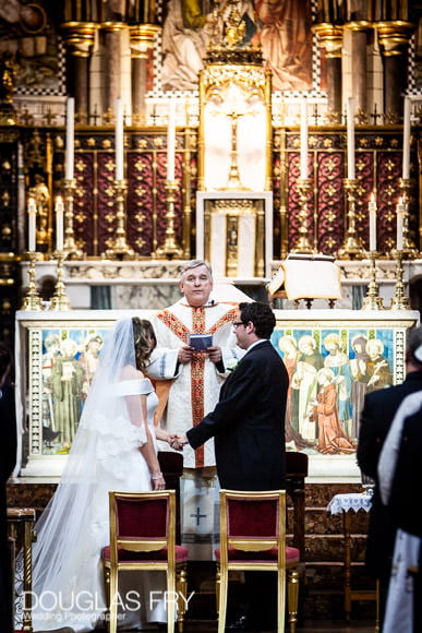 Couple exchanging vows in London Church