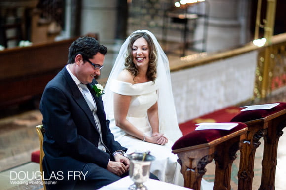 Couple photographed during wedding service in Church