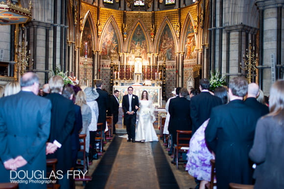 wedding photograph of couple walking down aisle in London church - St Columbas