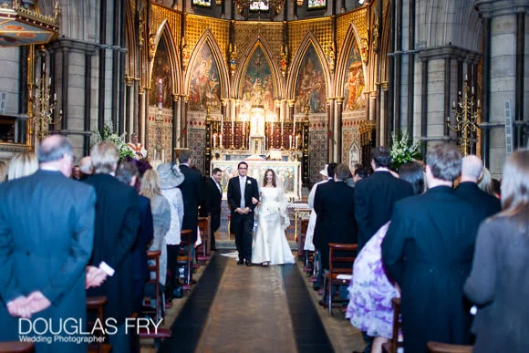 New Photo Book for Wedding at The Royal Institute of British Architects (RIBA), London 6 wedding photograph of couple walking down aisle in London church - St Columbas