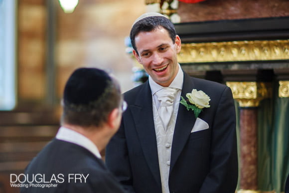 Groom waiting for bride to arrive at london synangogue. Photograph by Douglas Fry