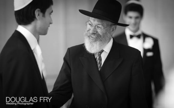 Rabi greeting groom during jewish wedding in London