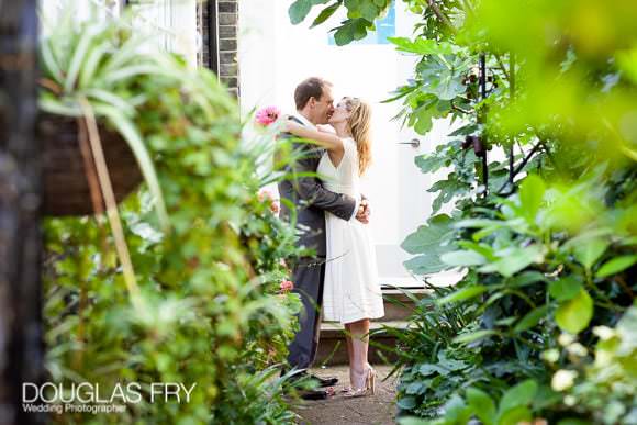 Wedding with Pink Colour Scheme at Ranelagh Gardens, The Royal Hospital, Chelsea 4 Chelsea wedding street photograph of couple kissing