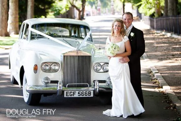 Wedding with Pink Colour Scheme at Ranelagh Gardens, The Royal Hospital, Chelsea 9 Couple pictured with Rolls Royce in Chelsea
