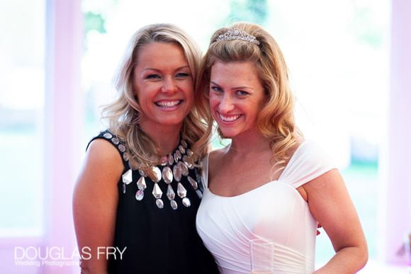 Bride and friend in marquee