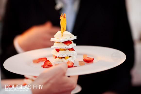 Photograph of desert at wedding reception in London with strawberries and merinque