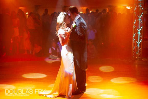 Wedding photograph of bride and groom dancing