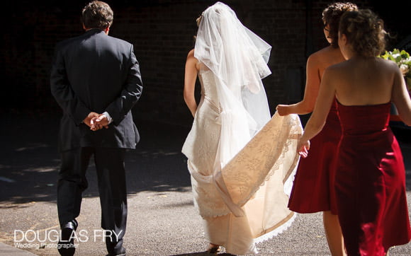 Bride entering HTB for wedding service in London