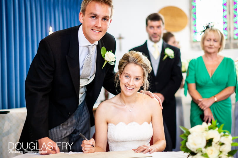 signing the register wedding photograph