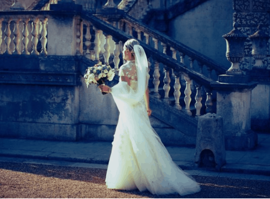 Wedding Photograph of the bride walking in front of Chiswick House