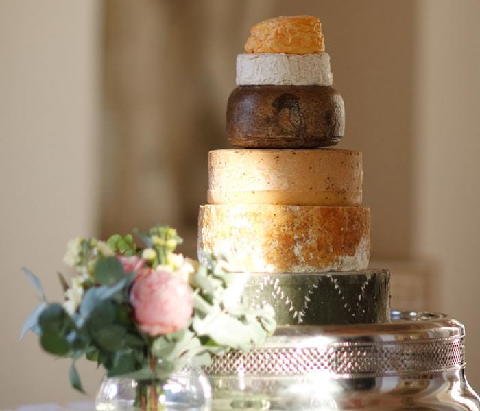 Wedding photograph of wedding cake made from a selection of different cheeses.