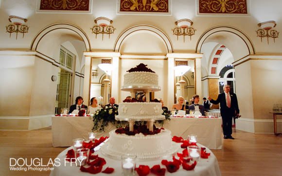 Wedding photograph of cake in ballrom in London