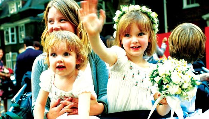 Children leaving wedding in Chelsea in Tuk Tuk