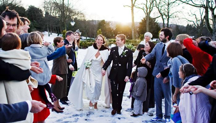 bride and groom in the snow Seonaid and Stu in Buxton, Cheshire - Wedding Photographs 1