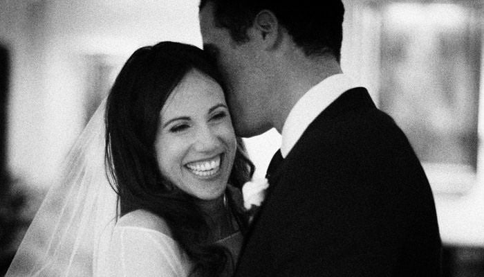 Bride and groom kissing at the RAC club in London