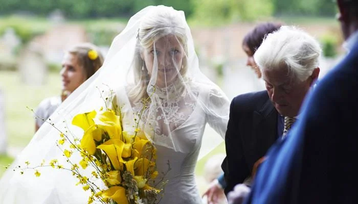 bride with bouquet of yellow flowers Harriet and Simon's Wedding Photographed in Hertfordshire 1