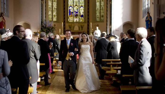 bride and groom aisle at church Wedding Photographer Rousham House & St John Church, Banbury 3