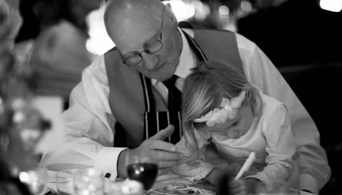 grandfather and bridesmaid at dinner Wedding Photographer Rousham House & St John Church, Banbury 4