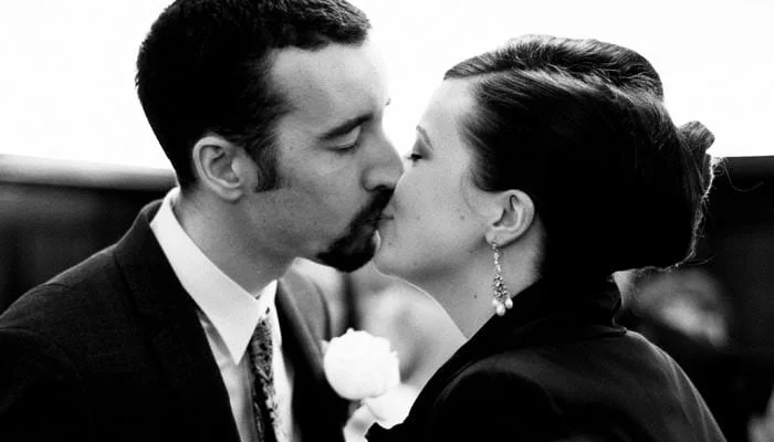 Wedding photograph of bride and groom kissing in fulham register office Elizabeth and Mike's Wedding Photographs taken at Fulham Register Office, Brown's Hotel and Hunan's Restaurant in London 1