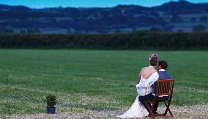 Wedding Photograph of Bride and Groom admiring the Shropshire view at end of wedding Wedding Photograph of Bride and Groom admiring the Shropshire view at end of wedding