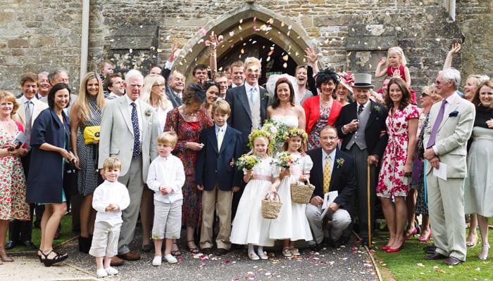 Wedding Photograph of Everyone outside the Church in Avening Gloucestershire