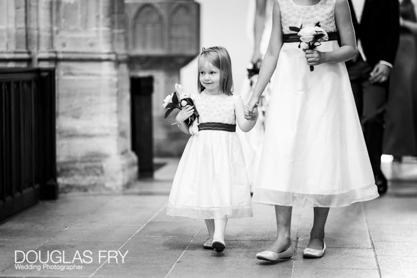 Bridesmaids arriving at Sherborne Abbey in Dorset for wedding