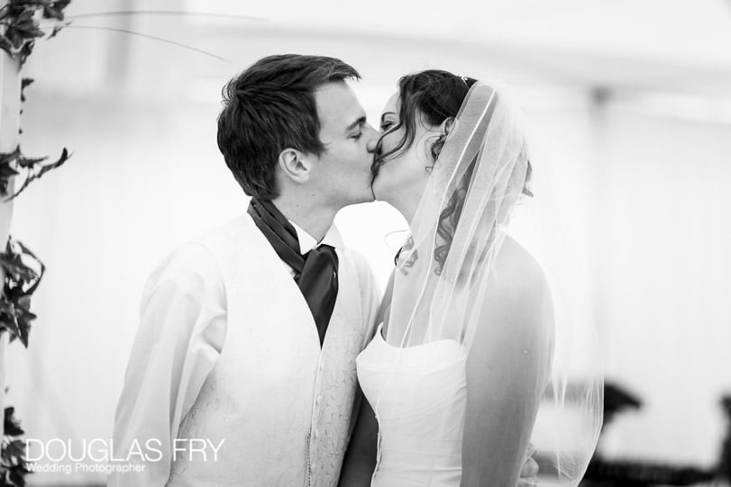 Bride and groom kissing