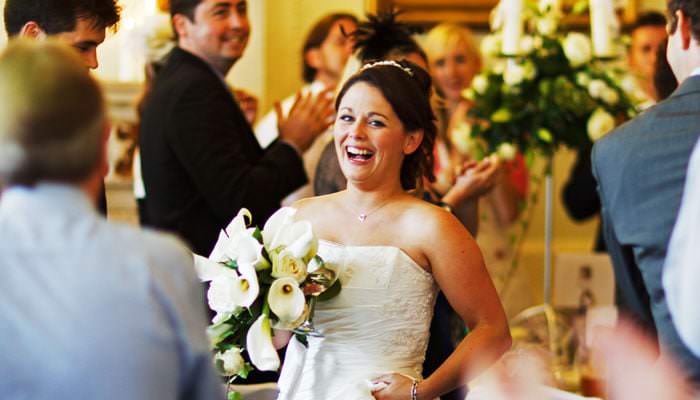 Wedding photograph of bride entering dinner at Northcote House, Ascot