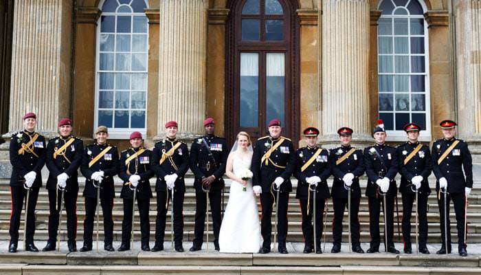 Wedding photograph of bride and groom with regiment at Blenheim Palace, Oxfordshire