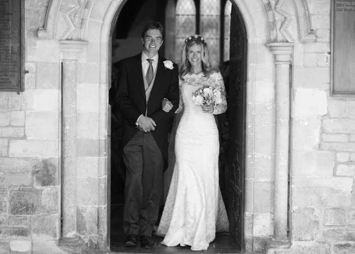 Wedding Photograph of bride and groom at Kemble church in black and white Wedding Photograph of bride and groom at Kemble church in black and white