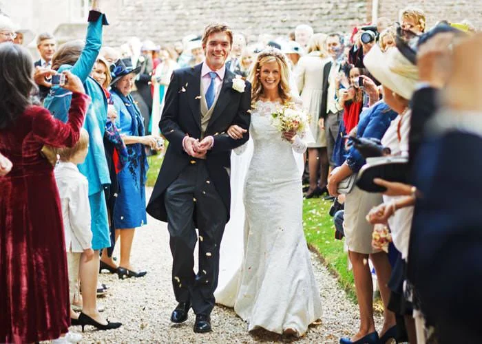 Wedding Photograph of bride and groom at Kemble church Wedding Photograph of bride and groom at Kemble church