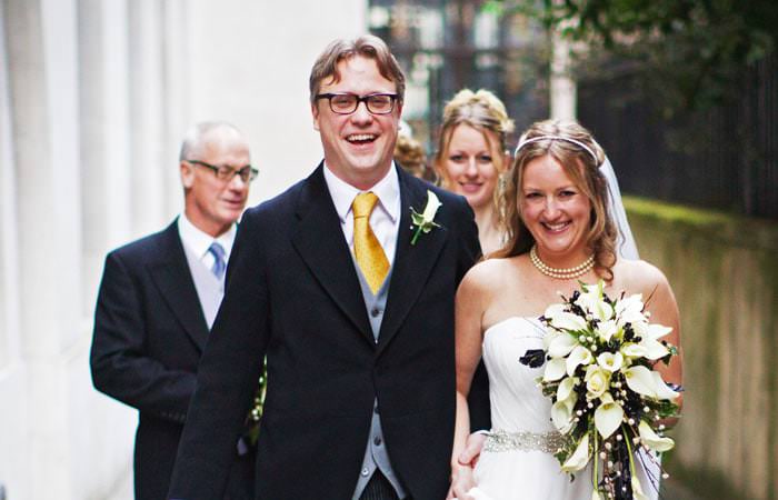 Wedding Photograph of Beth and Alex leaving St Bride's Church, London