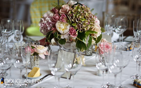 Table settings and flowers on tables at wedding in London