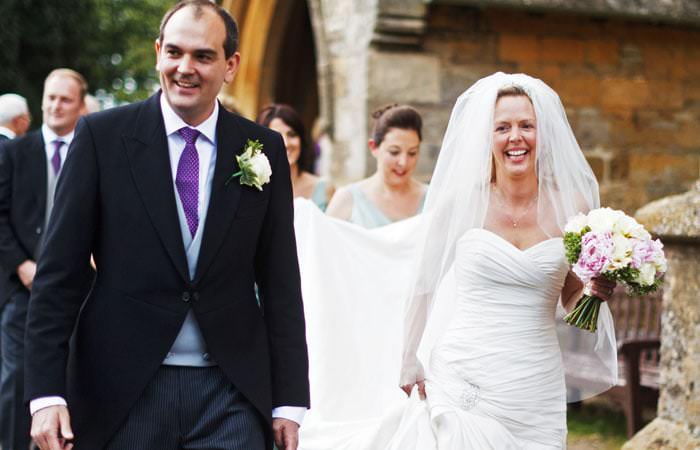 Wedding Photographer - bride and groom outside church in Stow-on-the-Wold