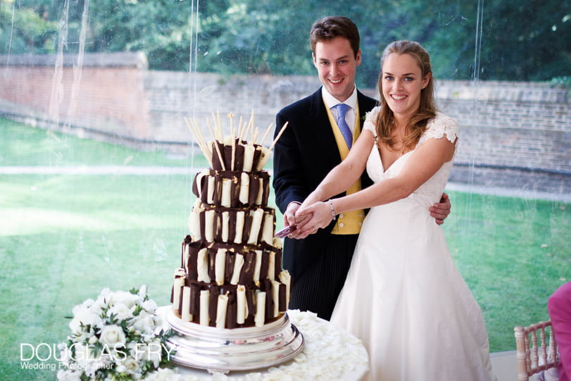 wedding photograph of cake cutting in London