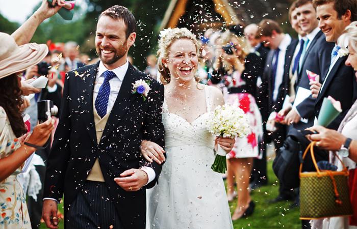 Wedding Photograph Bride and Groom with Confetti Surrey