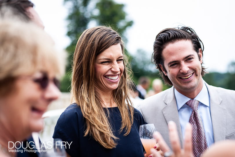 Guests having drink at wedding reception at Coworth Park