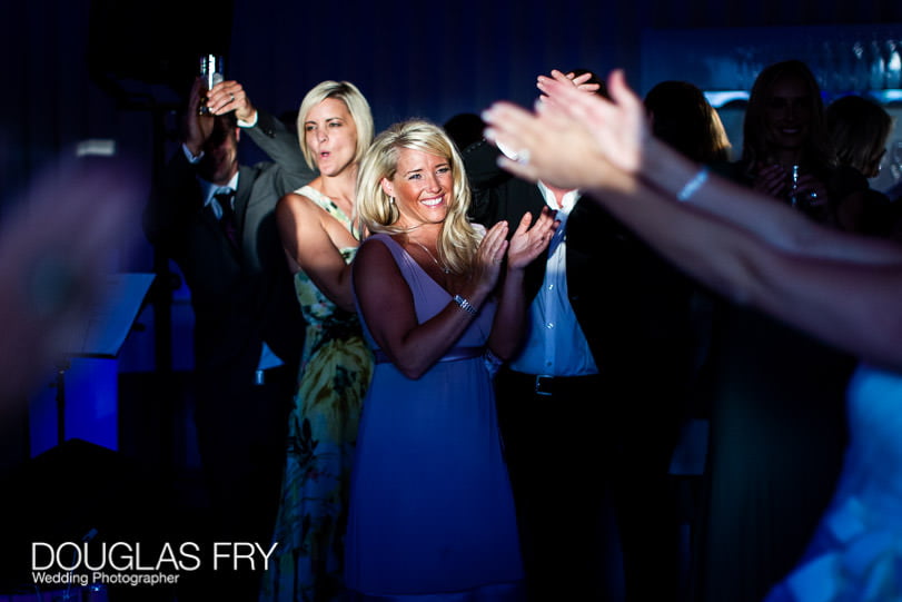 Guests dancing during wedding at Coworth Park