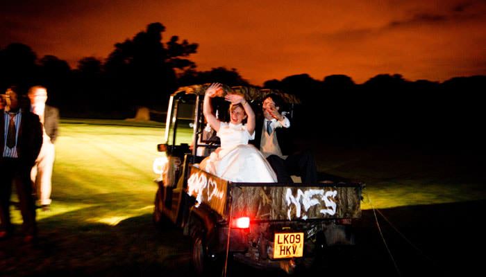 Wedding Photograph at Michlefield Hall, Hertfordshire - Going Away in Car