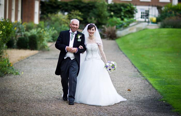 Bride and Groom Photographed at Wedding at St Etheldredas London