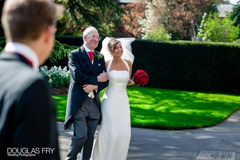 father and bride arriving photographed at Cambridge Cottage Kew by wedding photographer