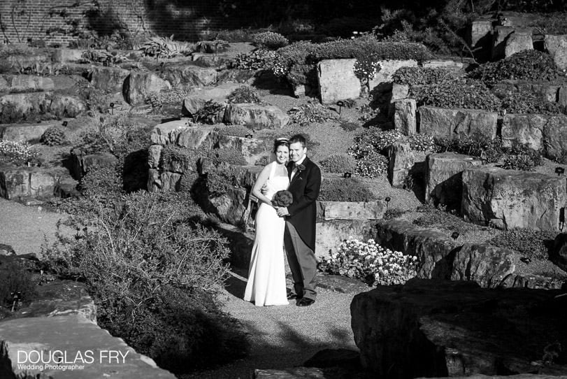 couple in black and white photographed at Cambridge Cottage Kew by wedding photographer