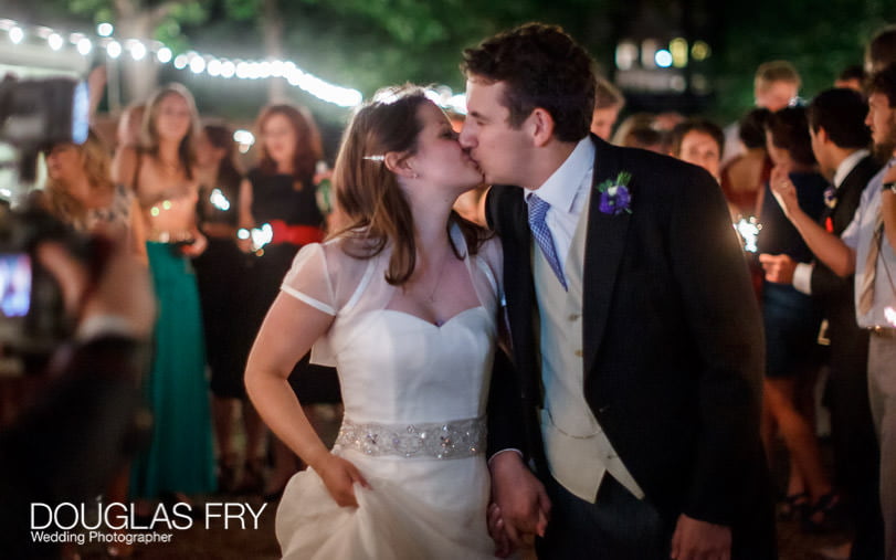 couple leaving Grays Inn at end of London wedding