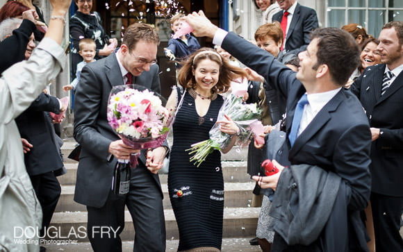 The Steps of Chelsea Town Hall - couple photographed with confetti