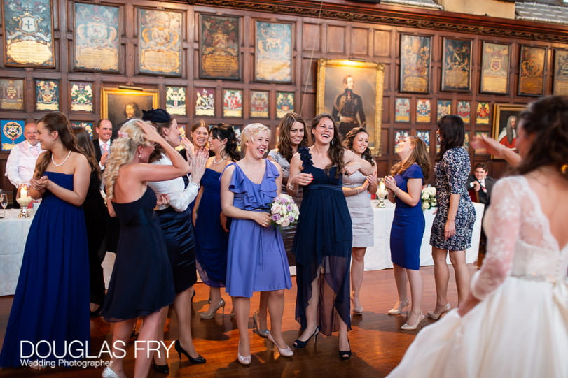 Wedding Photographer Lincolns Inn London - throwing the bouquet